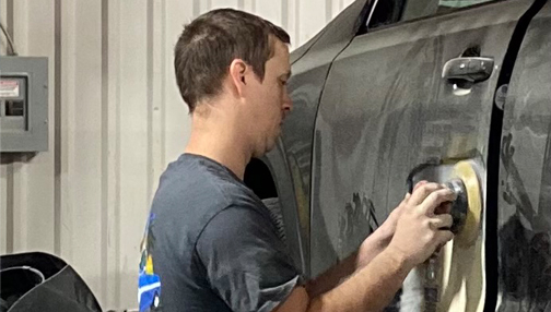 man doing some auto body repair work