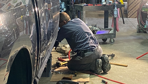 man doing some auto body repair work